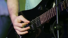 Rock musician playing six string electric guitar
