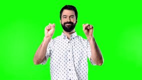 Man with beard counting one to ten on green screen chroma key