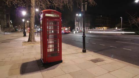 Time lapse - Telephone box at night in London, UK