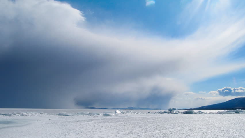 Winter Baikal landscape. Ice and clouds
