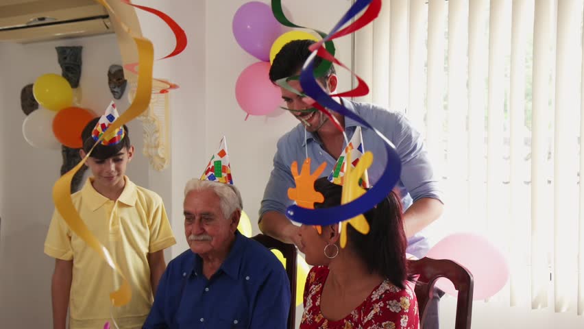 Group of old friends and family celebrating senior man birthday in retirement home. Happy elderly people having fun during party. Grandfather blowing candles on cake and smiling. Slow motion
 Royalty-Free Stock Footage #21955666
