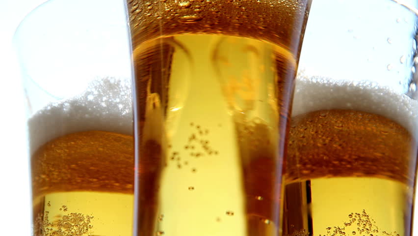 Close up of frosty beer glasses  turning clockwise .