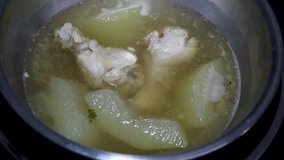Close up boiling winter melon Chicken Soup.