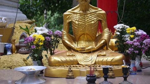Golden Thai Monk Statue in Buddhistic Temple