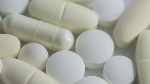 Pan over white pills