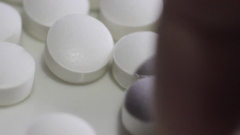 Pharmacist Handling White Pills