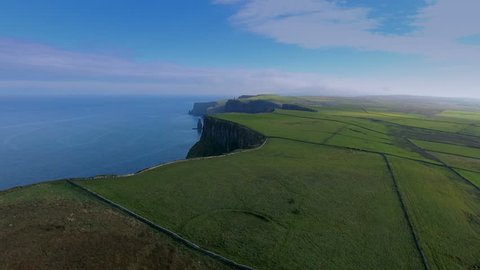 Aerial shot of the beautiful sea and the Cliffs of Moher. The Cliffs of Moher are located at the southwestern edge of the Burren region in County Clare Ireland.