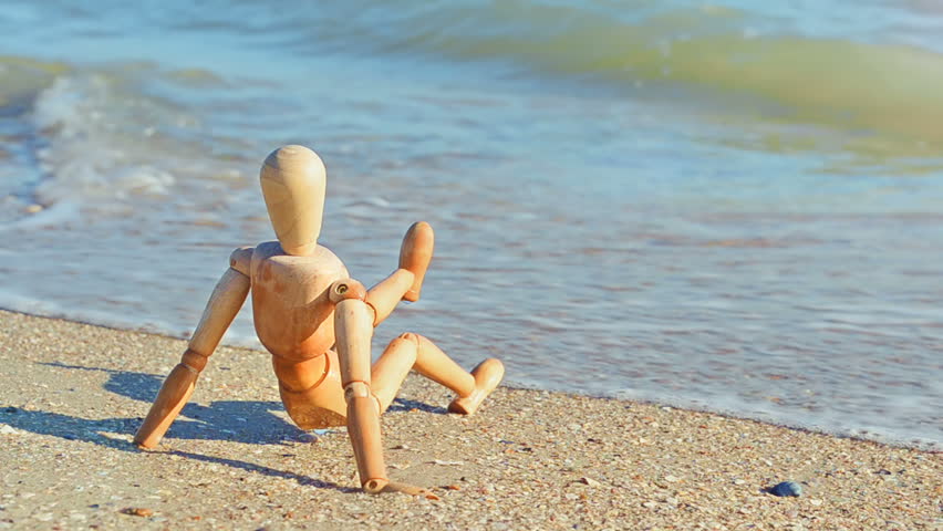 Wooden dummy on the beach.