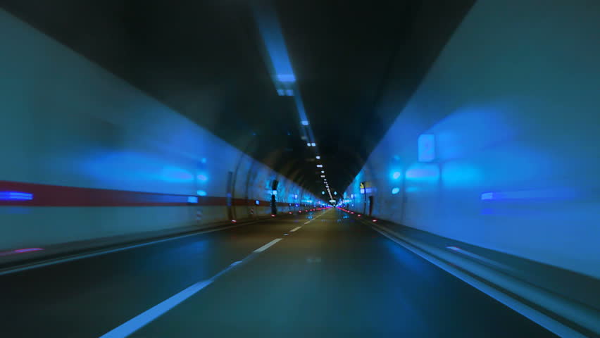 Car drivin on highway tunnel time lapse Looping normal speed