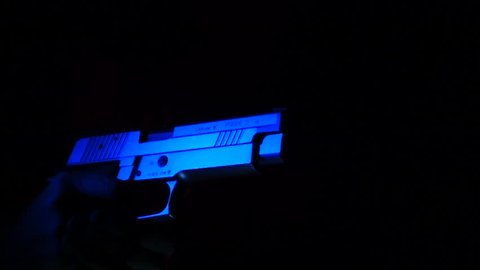 Slow motion SIG Sauer P226 gun close up shoots