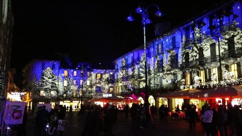 COMO, ITALY - DECEMBER 2, 2016: Festive Christmas decorations lights on facades of buildings on Piazza Duomo (Cathedral Square) in center of Como old town, Lombardy, Italy
