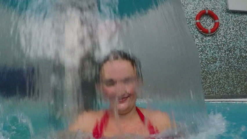 Woman Having Fun Under the Waterfall