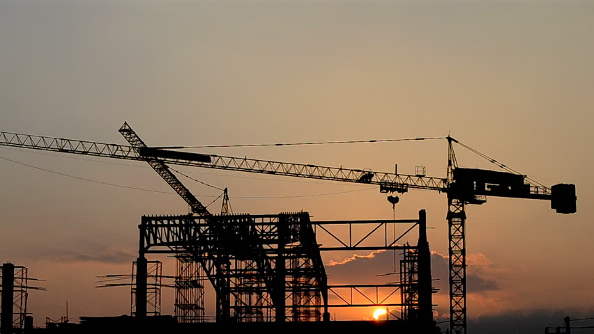 silhouette crane building and sunset of Southeast Asia