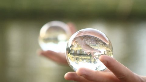 Man doing contact juggling on palms and crystal balls ஸ்டாக் வீடியோ