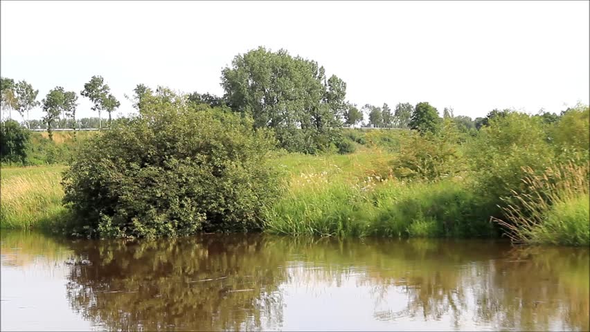 boat ride along a river, idyllic landscape
