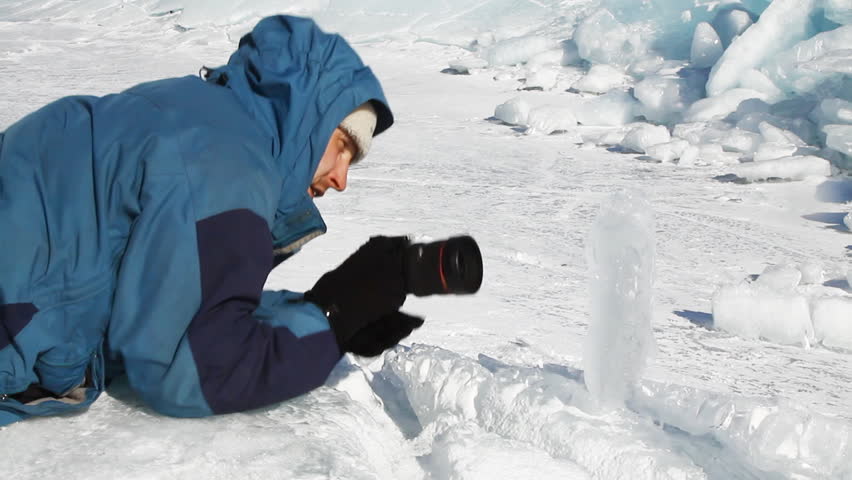 photographer taking picture of ice