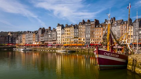 Honfleur Harbour Old Port, France, timelapse with beautiful houses and lots of tourists. Honfleur is located in the northern region of Calvados, Normandy, France