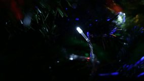 Dot LED lights blinking at night shallow DOF 4K 2160p 30fps UltraHD footage - Christmas tree decorative colorful bulbs close-up 3840X2160 UHD video