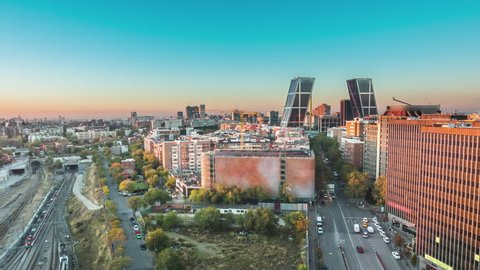 madrid skyline aerial view timelapse from night to day sun lighting the city