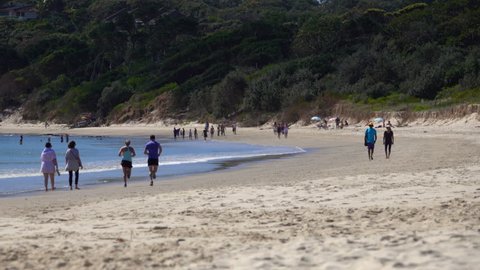 Australia, Byron Bay, Couple Running on the beach, Slow Motion