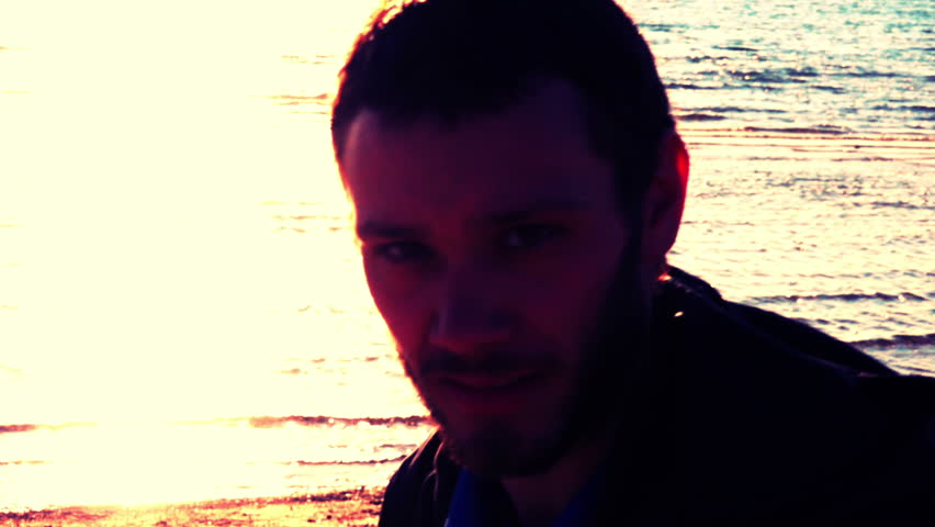 Boy Smile at Camera while Walking. Slow Motion, Beach, Sea Behind