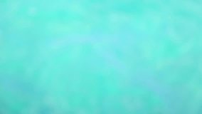 Blurry nature background. Out of focus sea water surface of bright blue color on sunny summer day. Real time full hd video footage