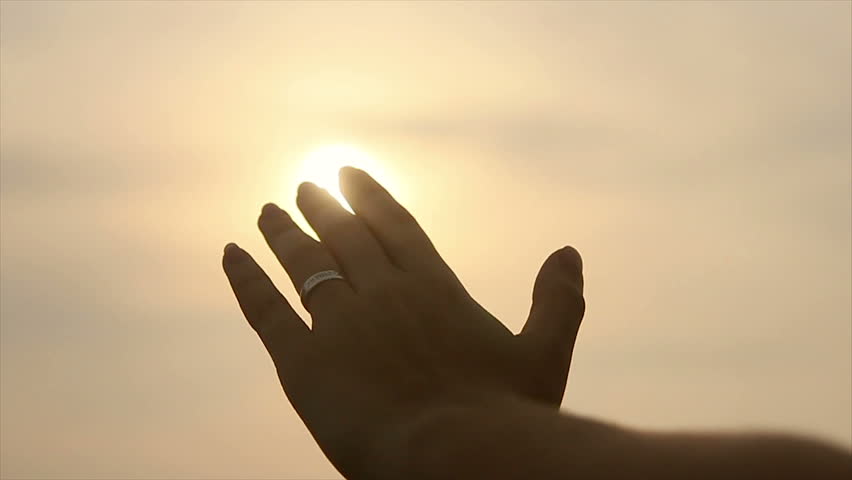 Girl's hand touches the sun | Shutterstock HD Video #2207212