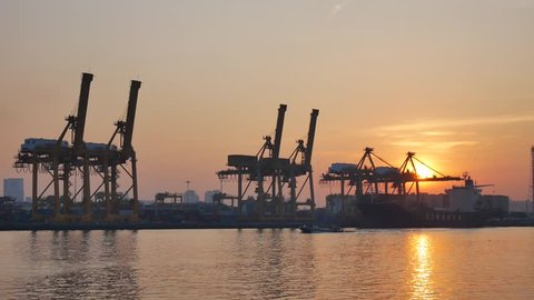Bangkok, Thailand - DECEMBER 9, 2016: Bangkok Port, one of the most significant ports in Thailand. Industrial Container Cargo freight ship with working crane bridge in shipyard on December 9,2016


