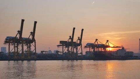 Bangkok, Thailand - DECEMBER 9, 2016: Bangkok Port, one of the most significant ports in Thailand. Industrial Container Cargo freight ship with working crane bridge in shipyard on December 9,2016

