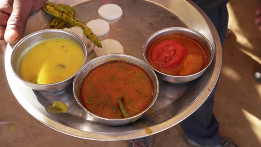 Indian food and sweets cooking, preparation, serving at a Dhaba- a traditional highway restaurant in India and South-East Asian sub-continent, mostly in non-urban areas 
   