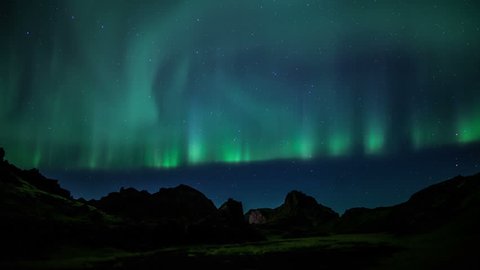 Bright aurora borealis rugged volcanic mountains Iceland realistic 4k