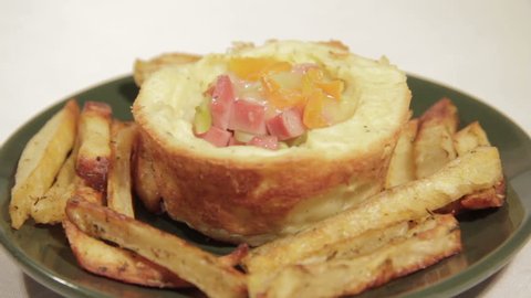 Homemade breakfast in potato tartlets with sausage, cucumber, bell pepper, cheese and potato sticks.
