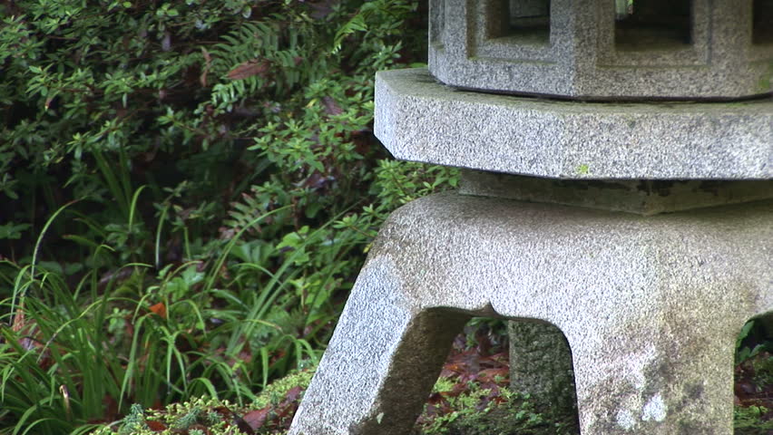Traditional stone lantern pagoda by pond, Japanese Garden in Portland, Oregon, zoom out Format: NTSC HDV Compression: MotionJPEG-A Camera: Sony HVR-Z1U Size: 1080i (1920 x 1080) Sound: No