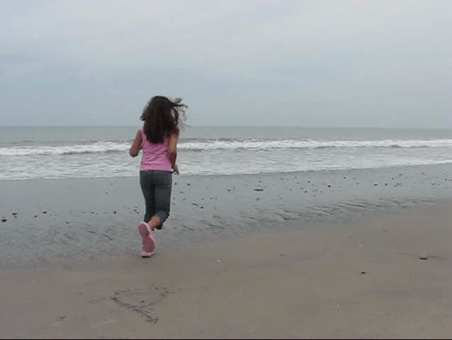 Girl running on the beach