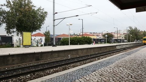 Train arriving at the station near Lisbon, Portugal
