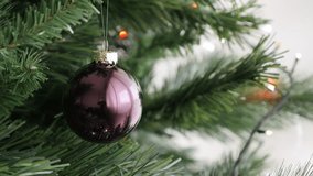 Close-up of New Year night round glass ornament 4K 2160p 30fps UltraHD footage - Shiny bronze color Christmas tree bauble 3840X2160 UHD video