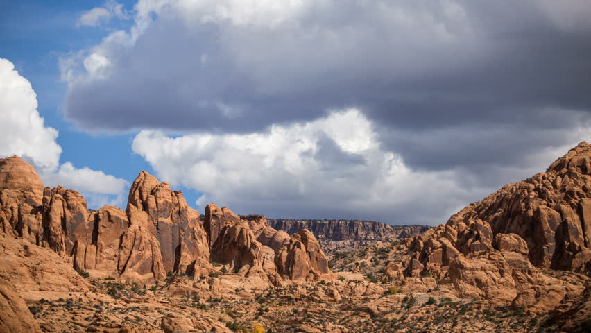 Time lapse over Red Rock Cliff in the desert of Moab Utah.