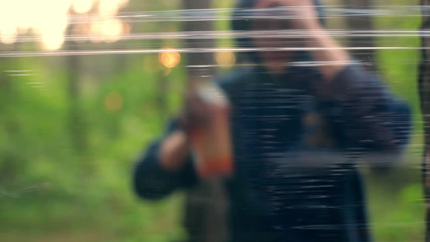 Graffiti artist at work creating graffiti painting