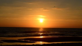 Sunset in the Beach with Yellow Sun and Sea Waves Landscape