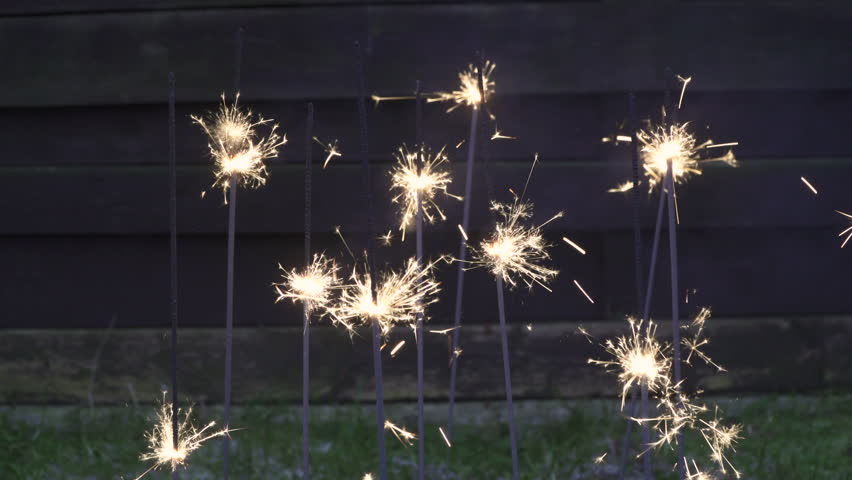 Slow-burning 9 sparklers pyrotechnic composition
A sparkler is a type of hand-held firework that burns slowly while emitting colored flames, sparks, and other effects. Royalty-Free Stock Footage #22148101