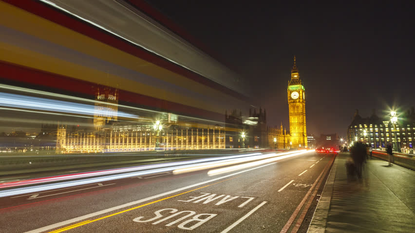 Big Ben time-lapse on the Westminster Bridge in London at Night , hyper lapse slow movement to the Big Ben.
Long shutter speed with long light trails. Royalty-Free Stock Footage #22150285