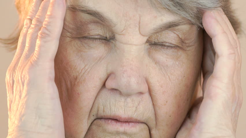 The old woman suffers from headaches. Face close up Royalty-Free Stock Footage #22151695