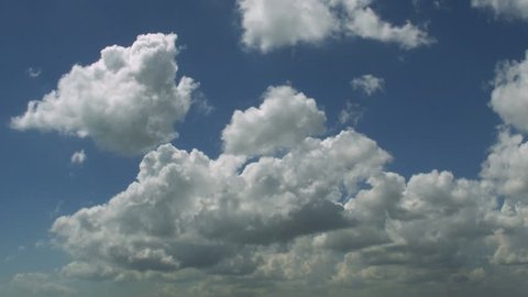 Timelapse of cumulus clouds in sunny day.