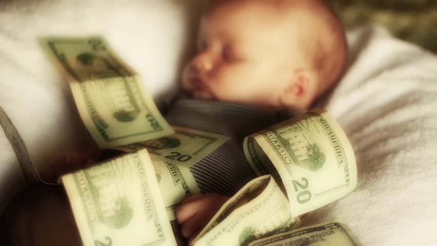 A baby lying in a pile of cash. (Babies are expensive)