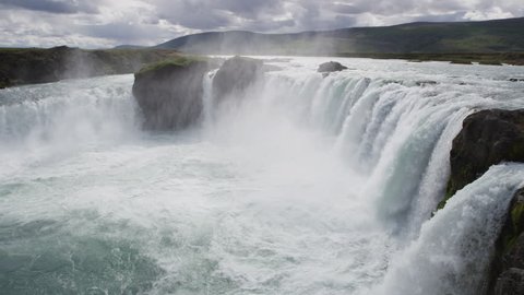 Iceland landscape scenic view of Godafoss waterfall against cloudy sky. It is one of the famous tourist attractions. It is a spectacular Icelandic waterfall on the North of island. 90 FPS RED EPIC.