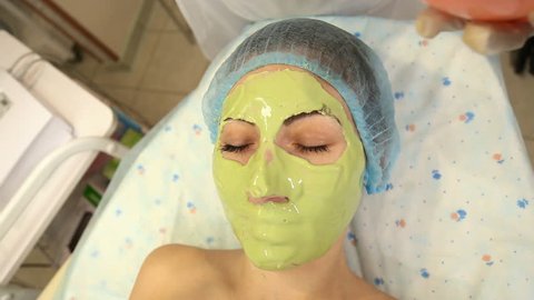 woman with green mask on her face