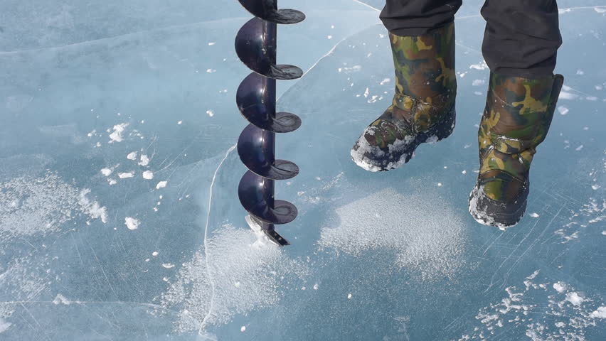 The man bore the ice ice screws.