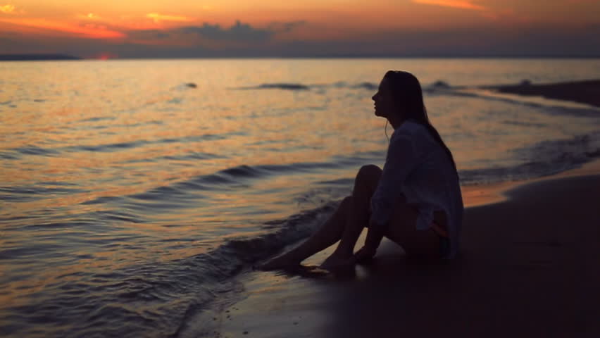 girl sitting on beach sunset Stock Footage Video (100% Royalty-free ...