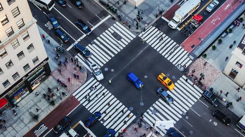 NEW YORK CITY - NOVEMBER 17: (TIMELAPSE) Aerial view from Empire State Building of intersection with pedestrian and vehicle traffic on 34th Street and 5th Ave on November 17, 2016 in New York, USA.