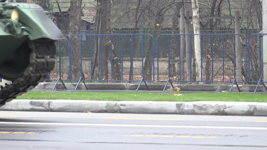 4K Closeup of military drill pass, tank machine transportation in front war combat by day